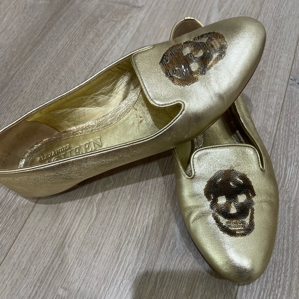 Alexander McQueen gold leather flats